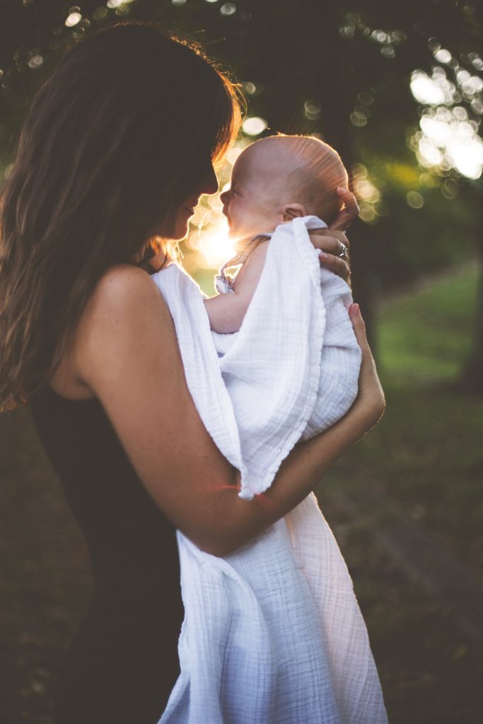 woman holding baby